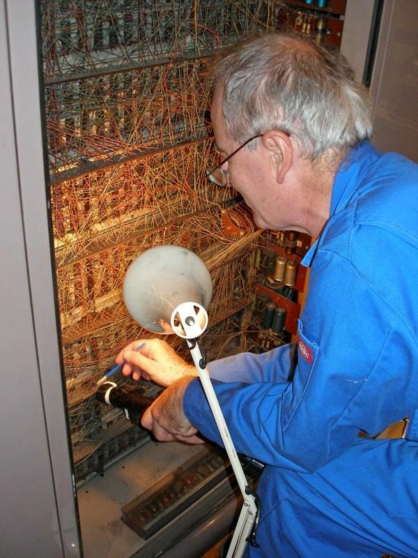 Volunteer cleaning CPU back-wiring